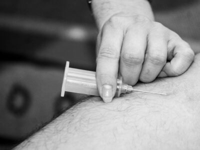 Medical injection syringe representing new twice-yearly hypertension treatment zilebesiran